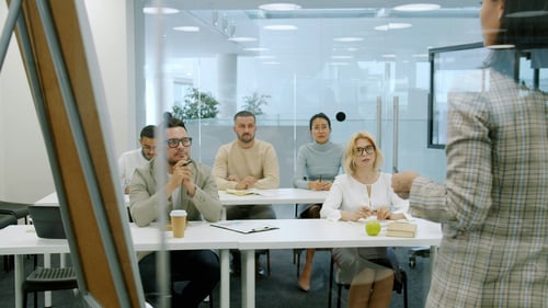 People in a room listening to a teaching