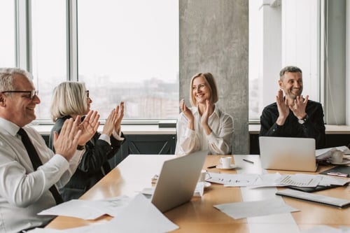People Celebrating in a Meeting 